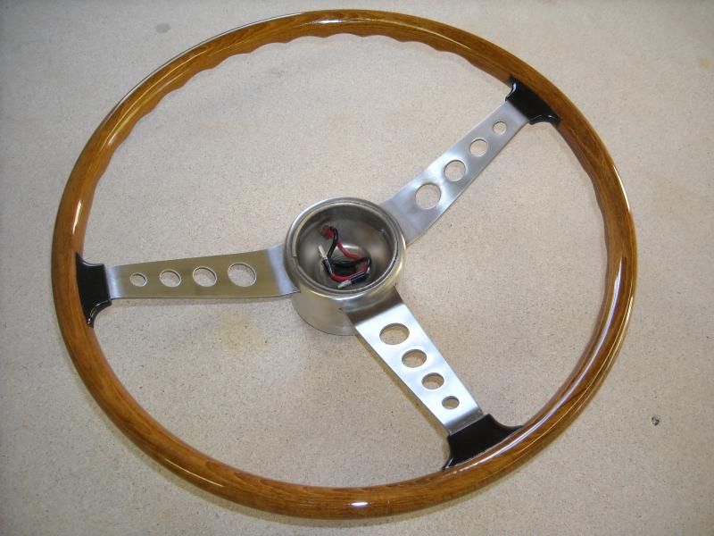 1967 wheel that needed new wood and spoke tabs (black boots).