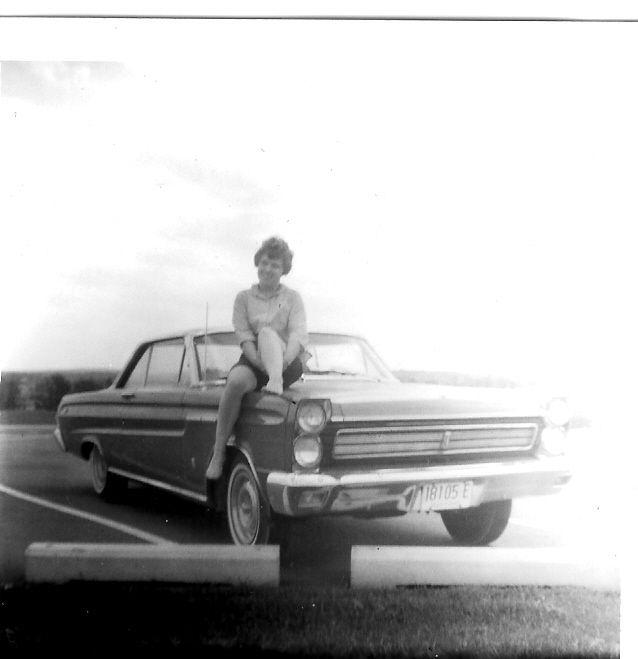 My mom on their 65 Mercury Cyclone in April 65